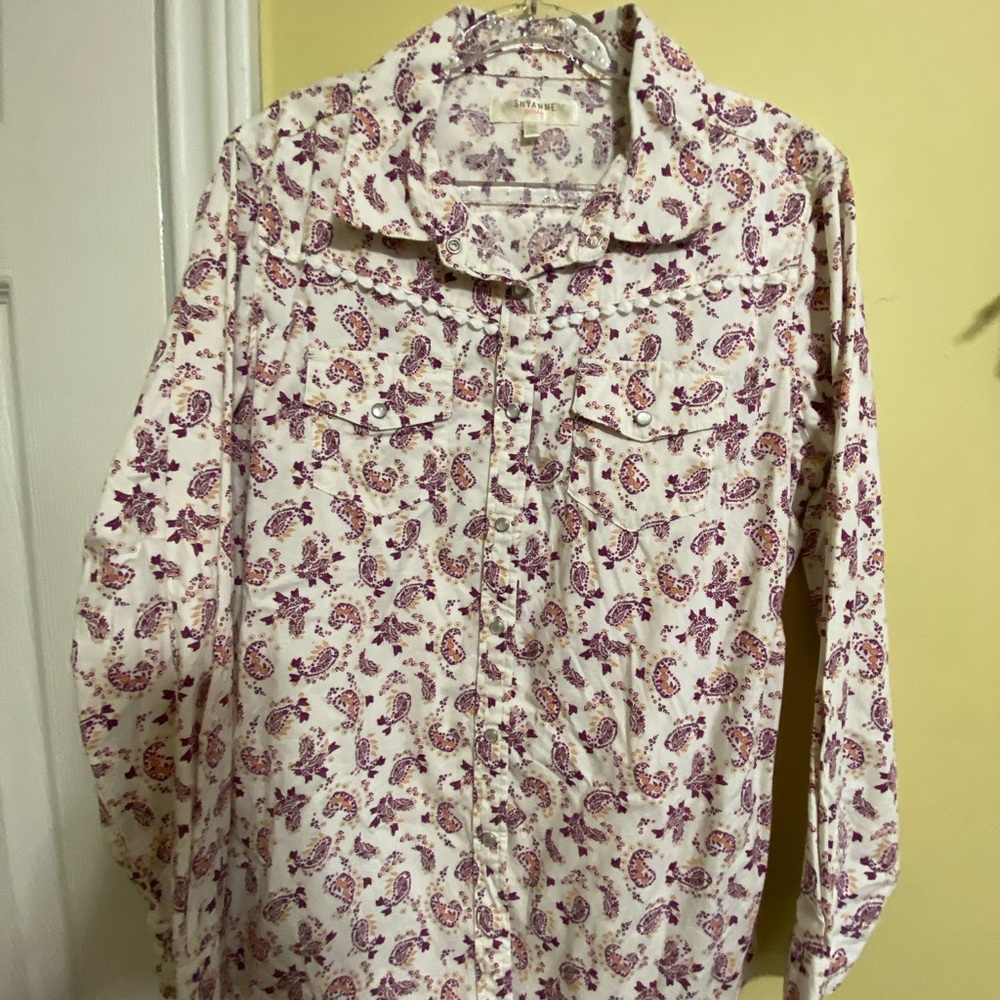 Young girl western shirt with snap buttons and two pockets.